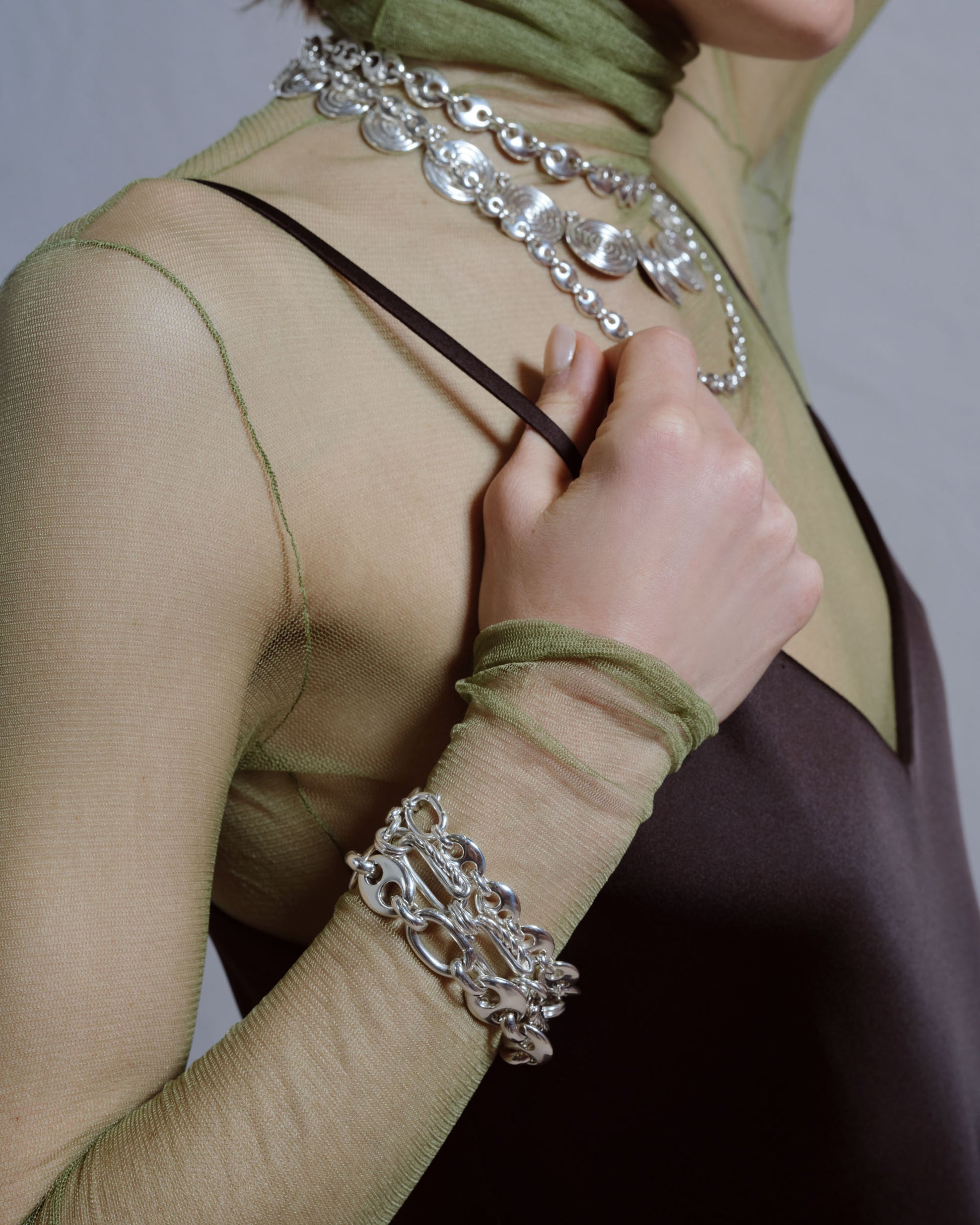 Styled image featuring CRZM jewelry on model.