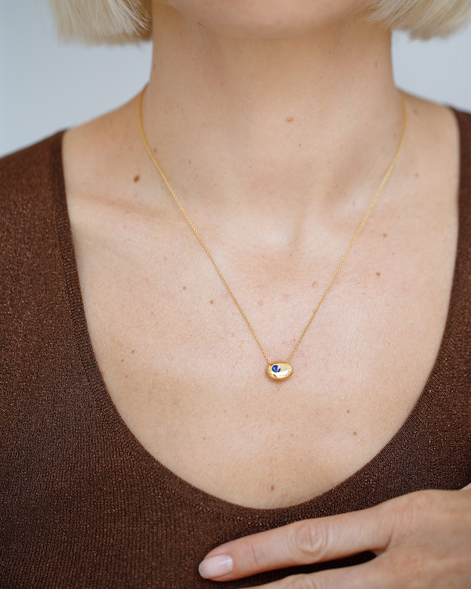 Gold Bicolor Blue Sapphire Level Necklace on model.