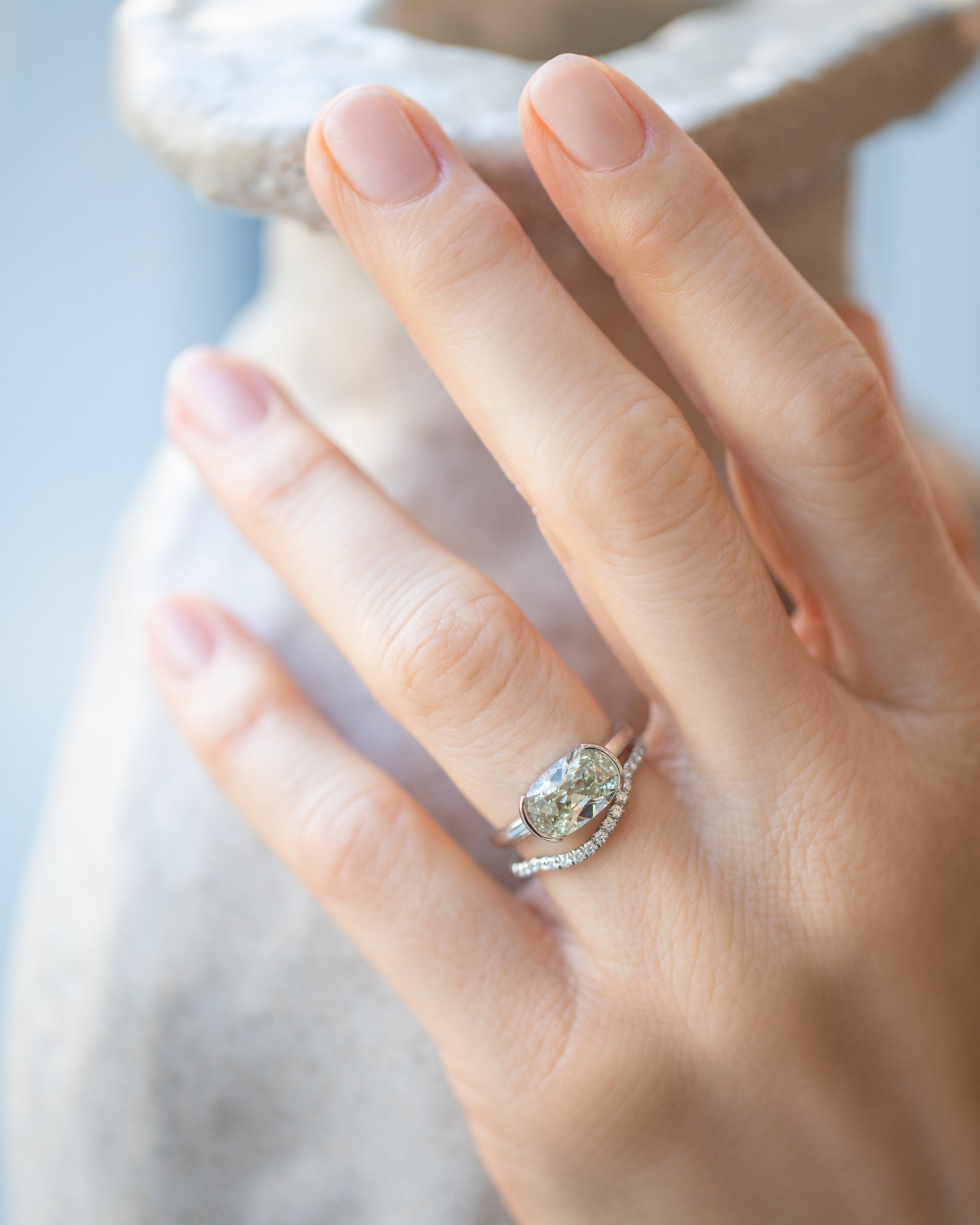 Shift Ring and Platinum White Diamond Pavé Mini Curve Bands on model.