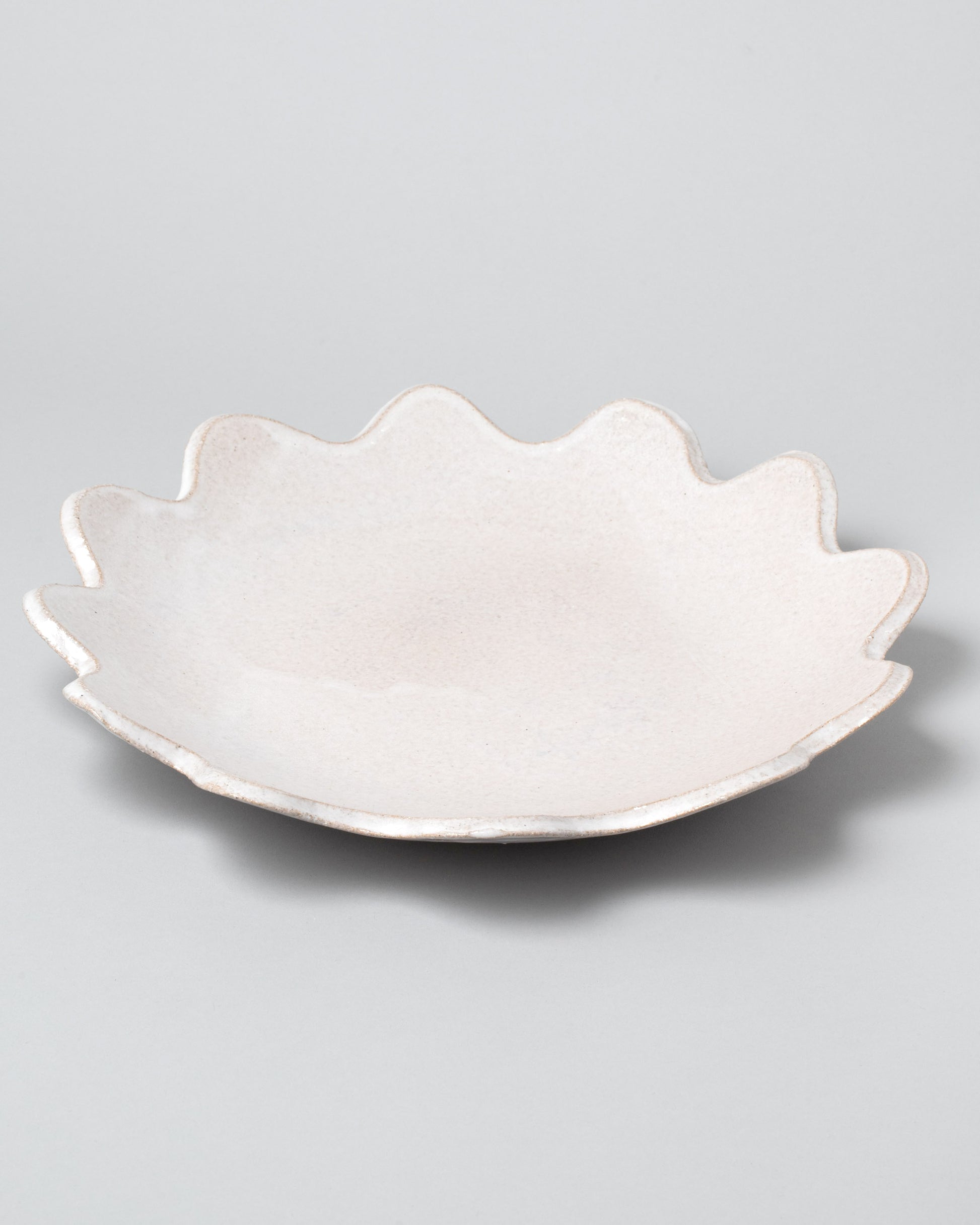 Morgan Peck Pearl Scallop Platter on light color background.