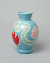 Laetitia Rouget Blue Tulip Vase on light color background.