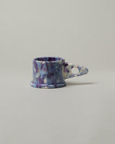 Echo Park Pottery by Peter Shire Triangle Handle Blue Splatter Mug on light color background.