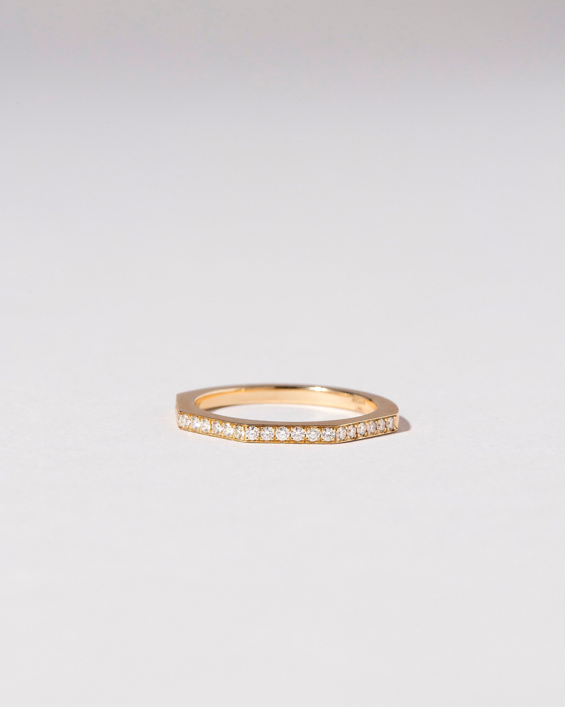  Segmented Band -  1.7mm Infinity Pavé on light color background.
