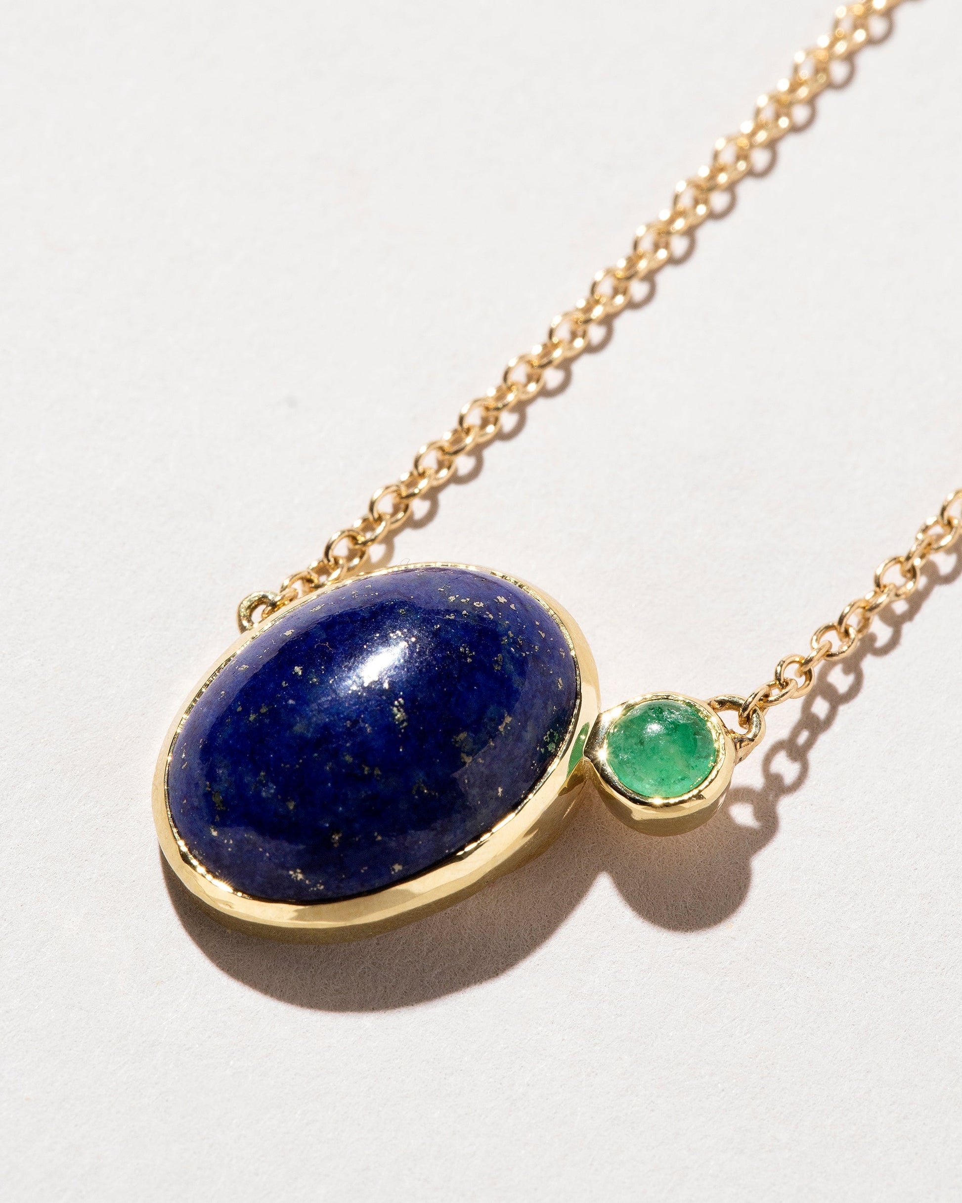  Lapis & Emerald Pendant Necklace on light color background.