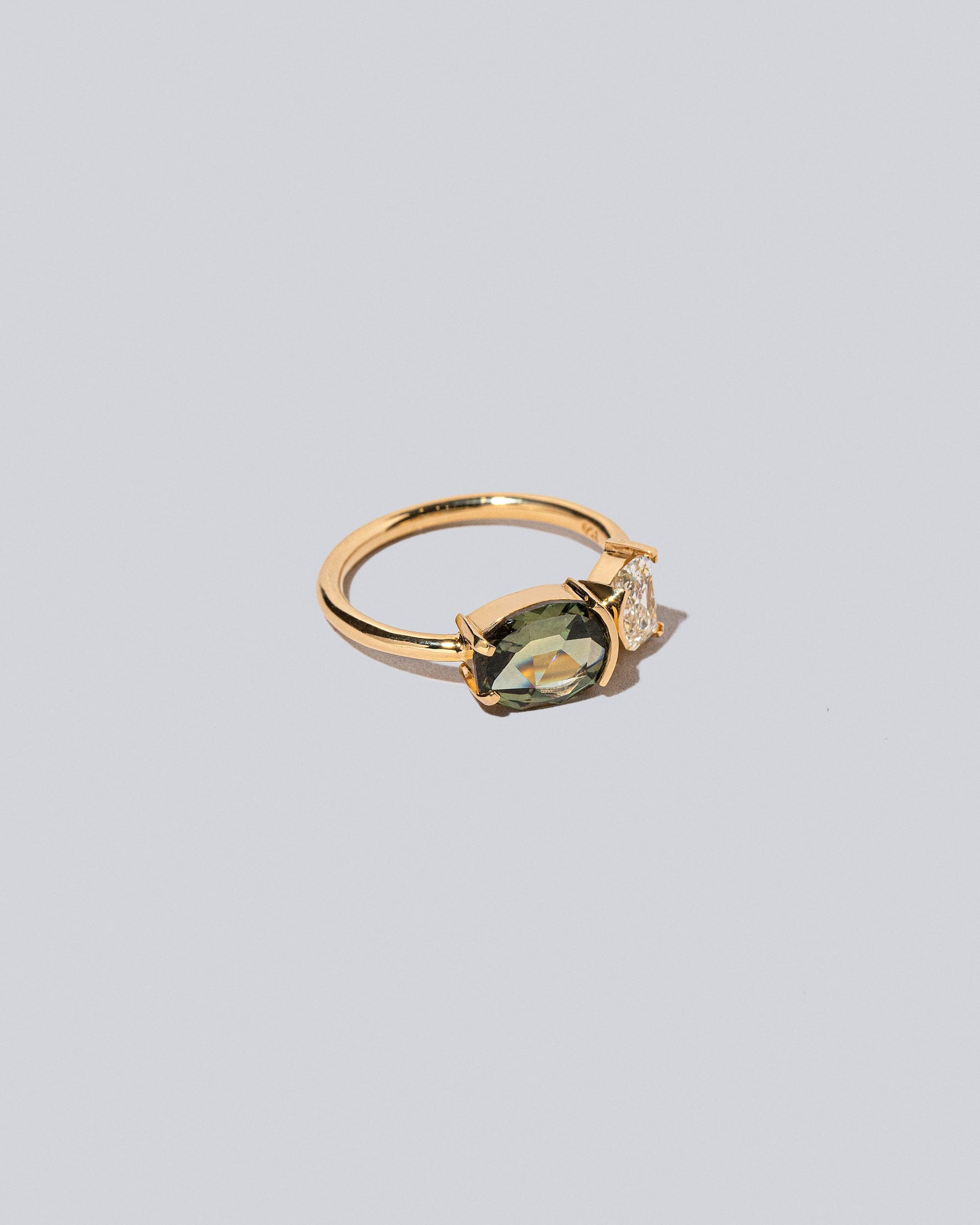 Product photo of Finch Ring on a light color background 