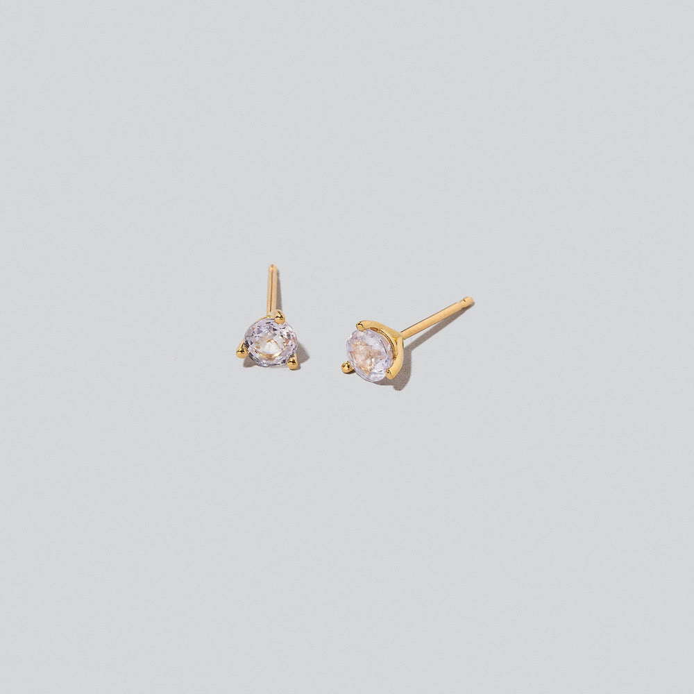 product_details::Martini Stud Earrings on light colored background.