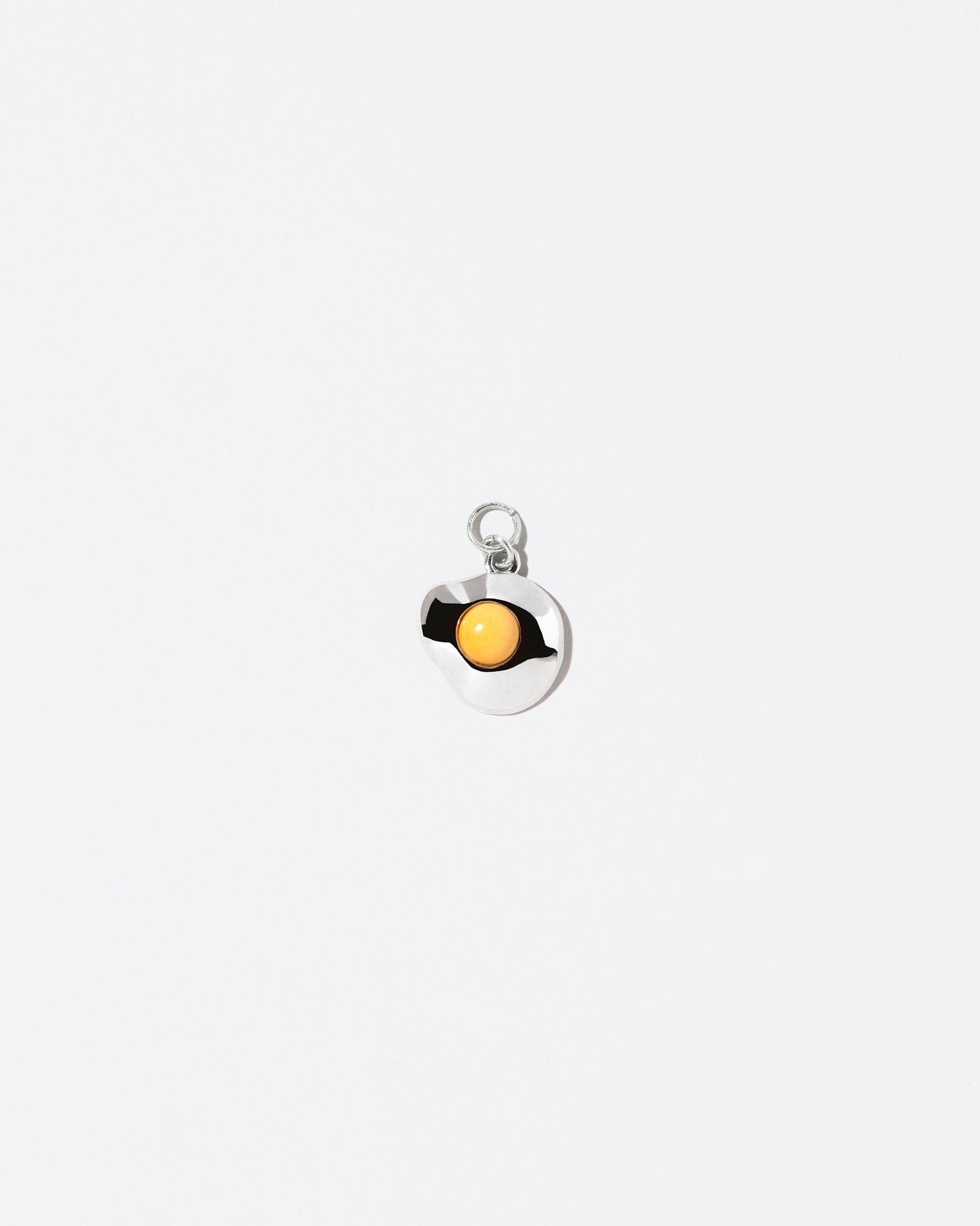Sunny Side Up Egg Charm Four on light colored background.