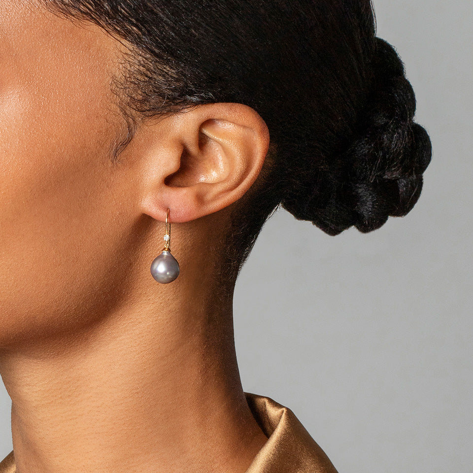 product_details::Moon Drop Earrings on model.