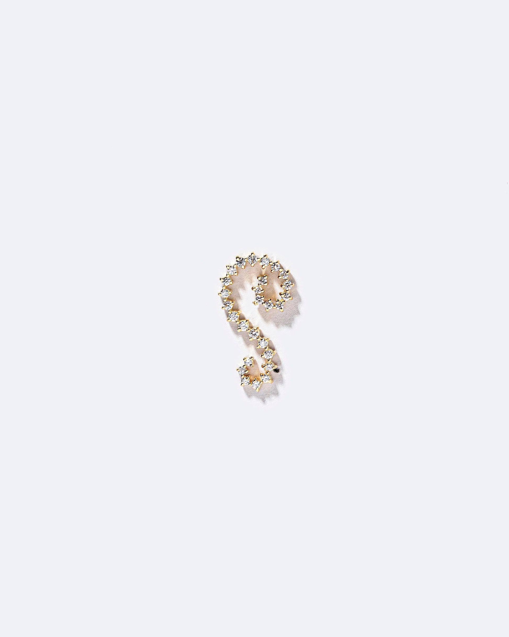 Right White Diamond Symbol of Change Earring Single on light color background.