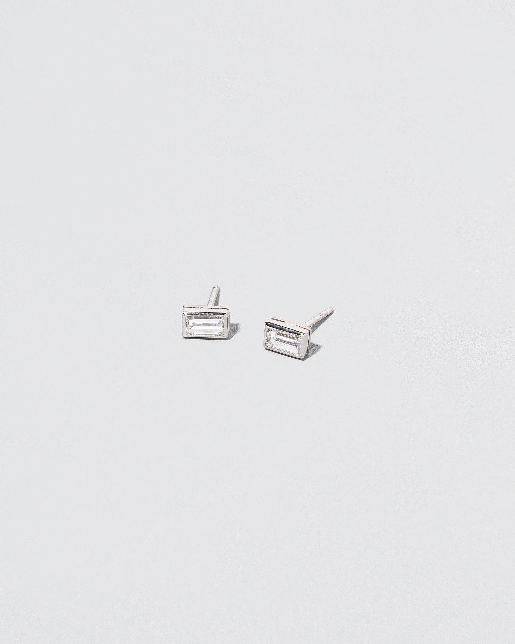  Baguette Studs in size large on light color background.