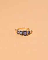  Geometric Sapphire Line Cluster Ring on light color background.