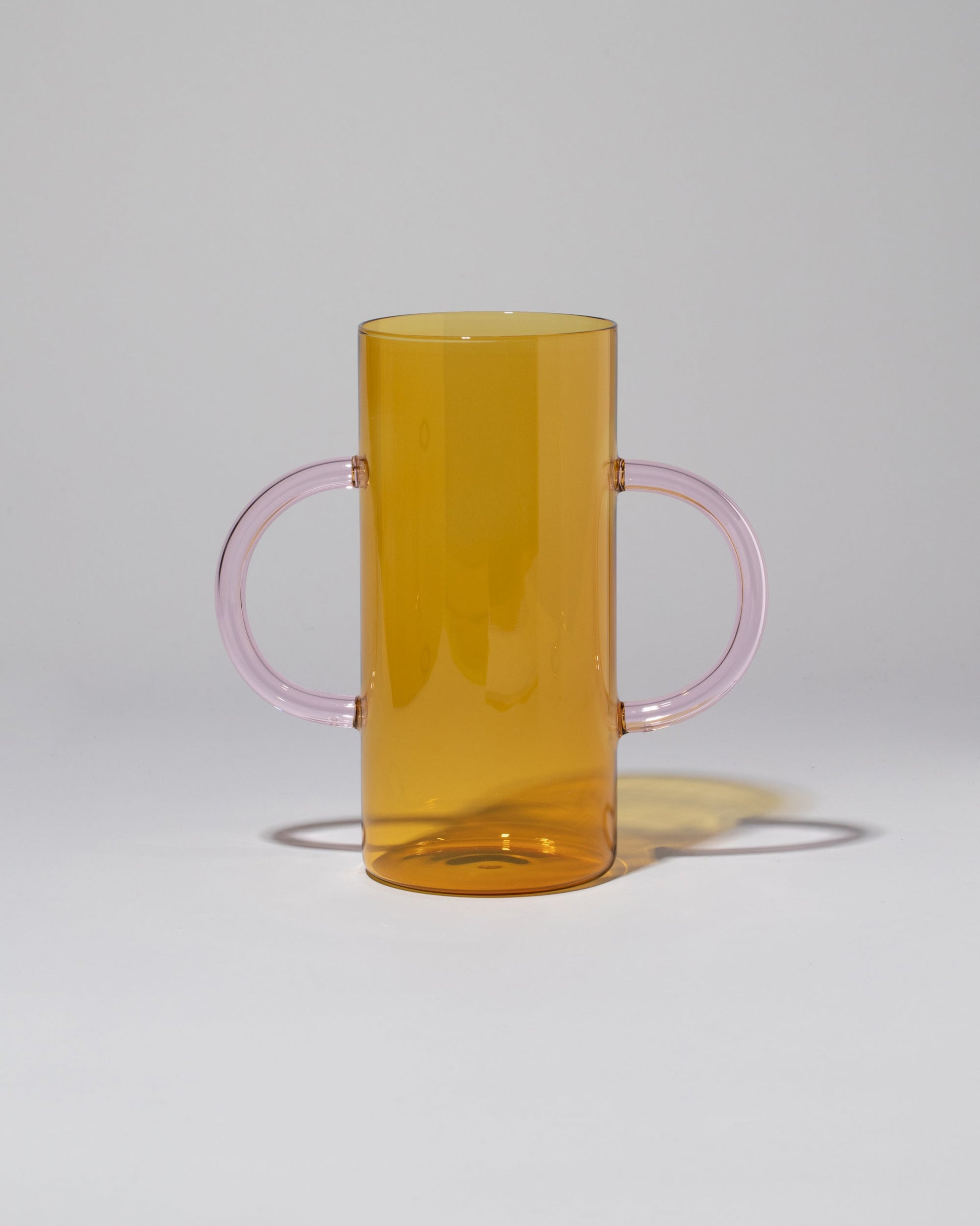 Sophie Lou Jacobsen Yellow with Pink Handles Handle Vase on light color background.