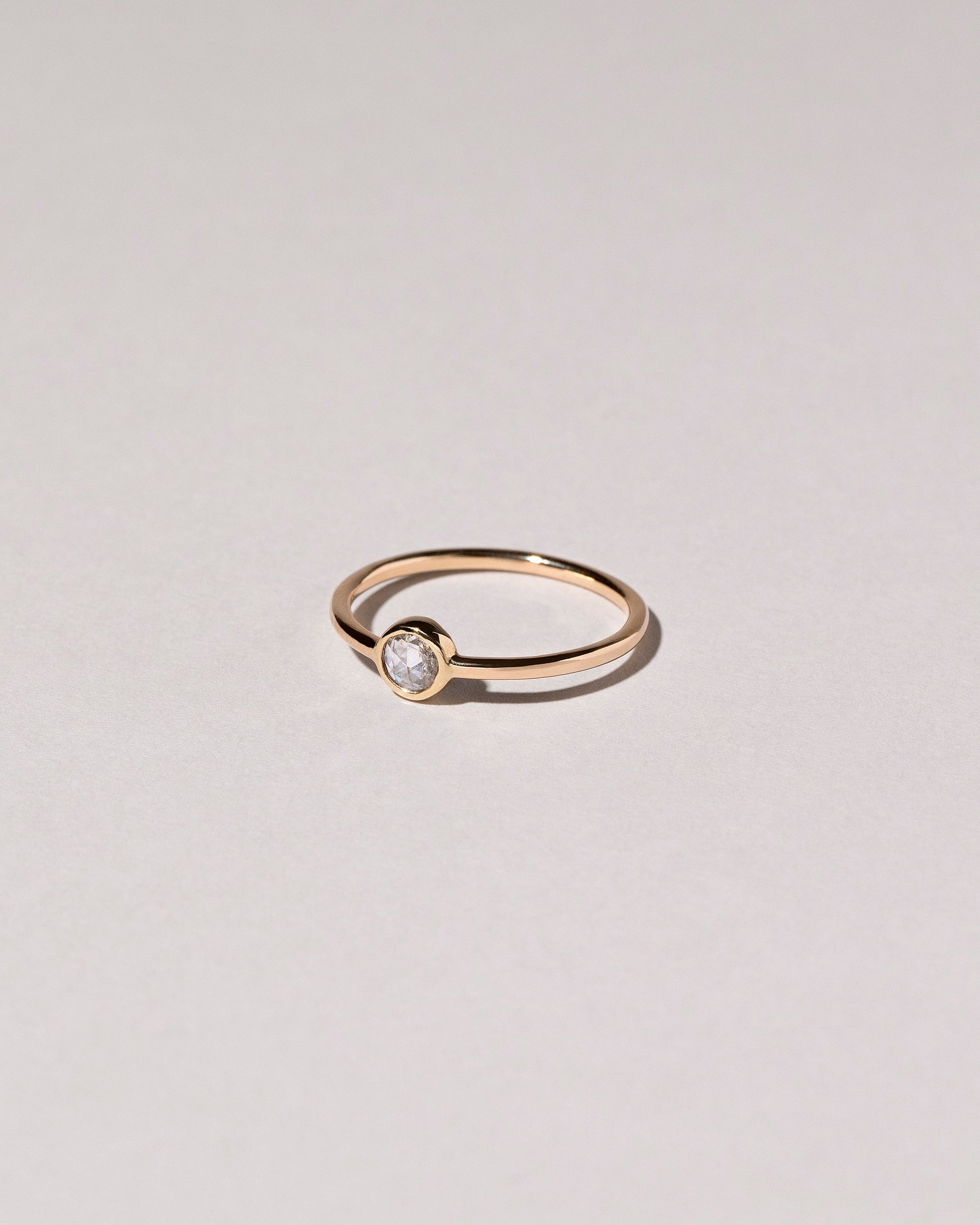 Rose Cut Purple Diamond Ring on light color background.