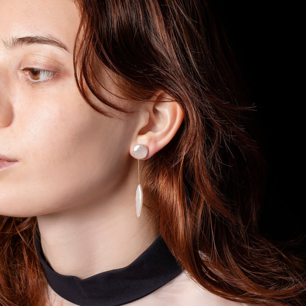product_details::Triton Earrings on model.