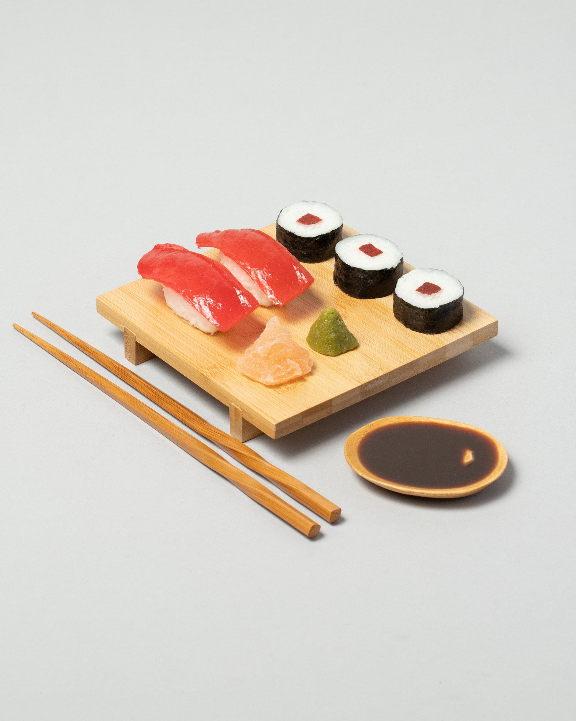 Spills Tuna Board Sushi Board on light color background.