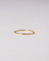 Gold 1mm Square Wire Band on light color background.