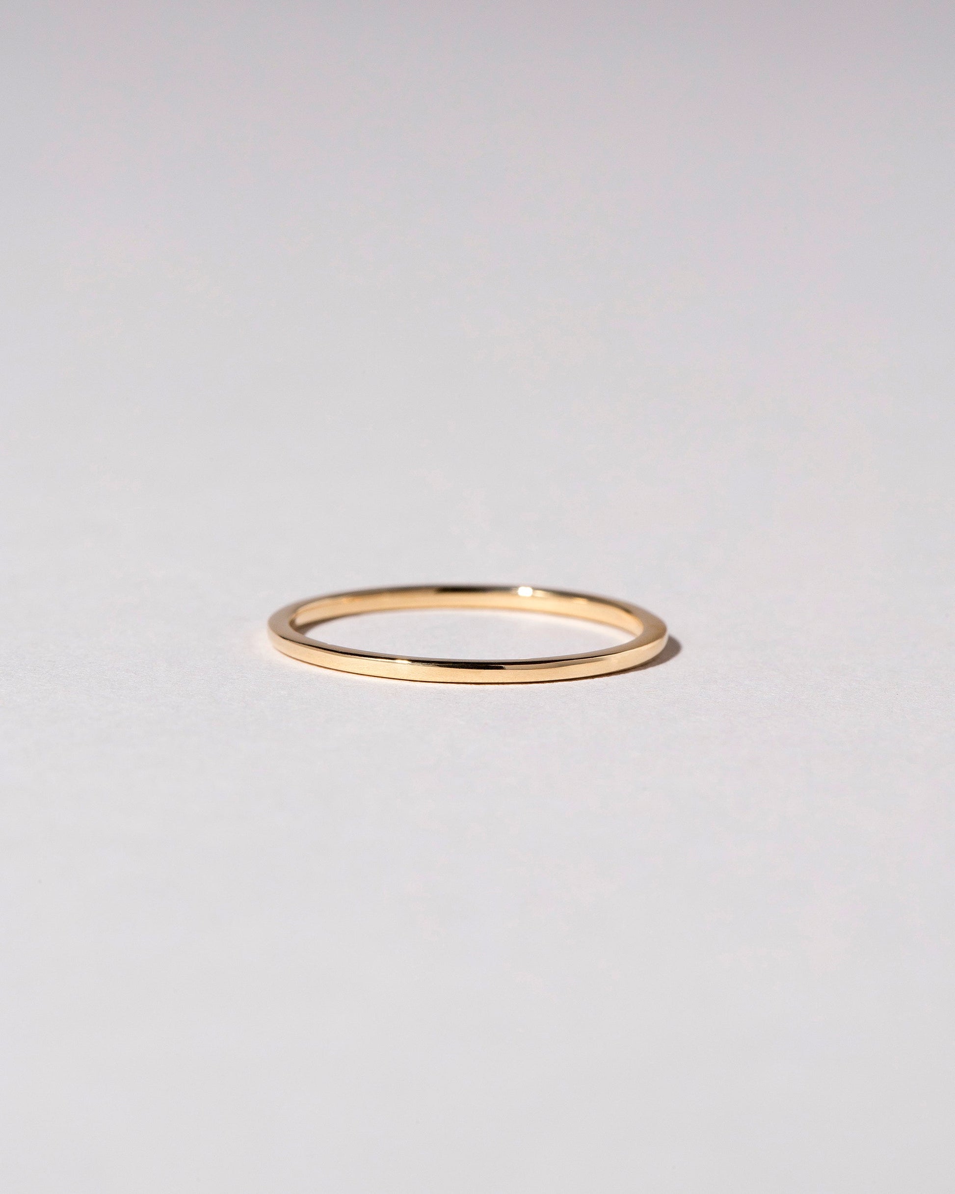 Gold 1mm Square Wire Band on light color background.