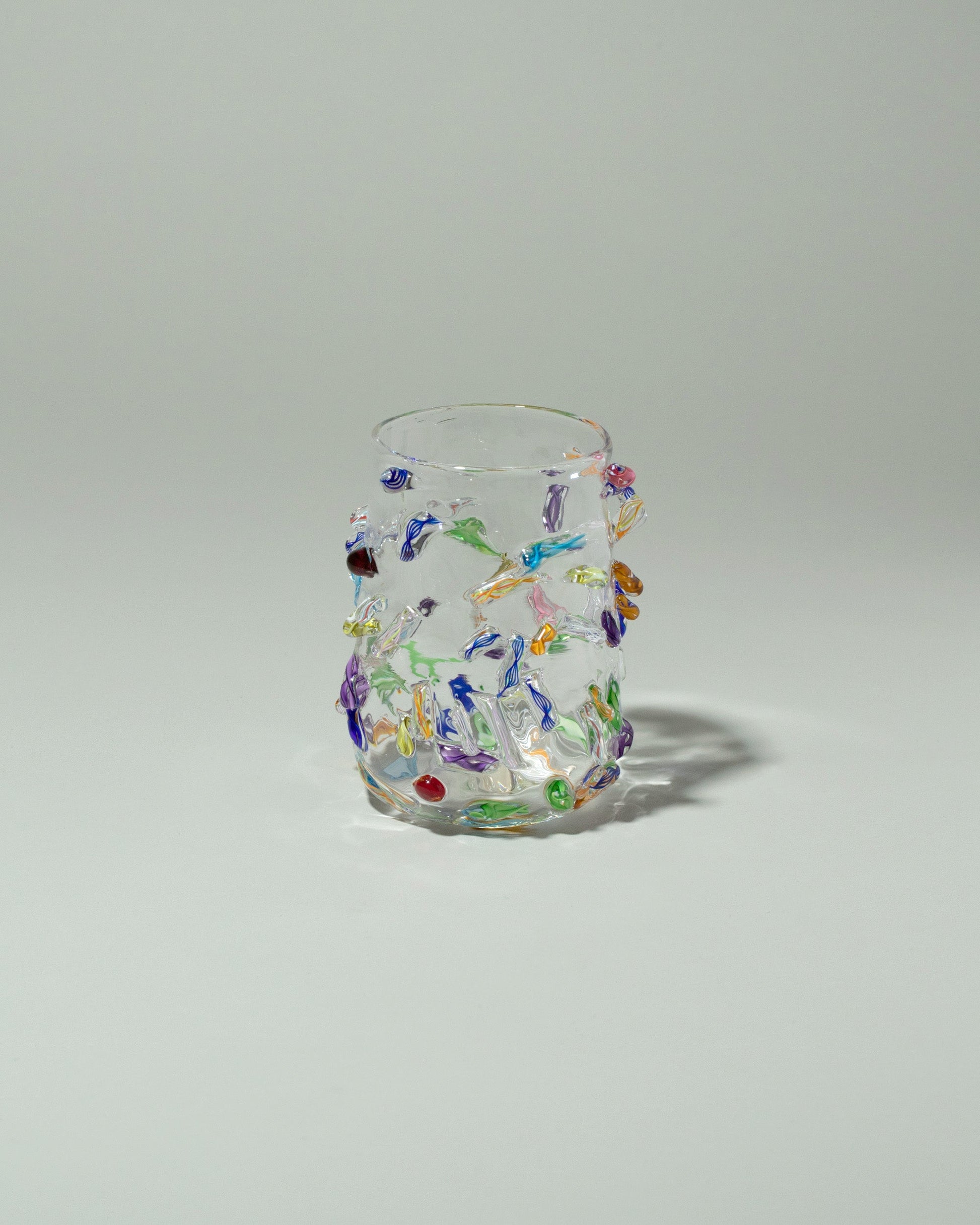 Stover Glass Cane Cup on light color background.