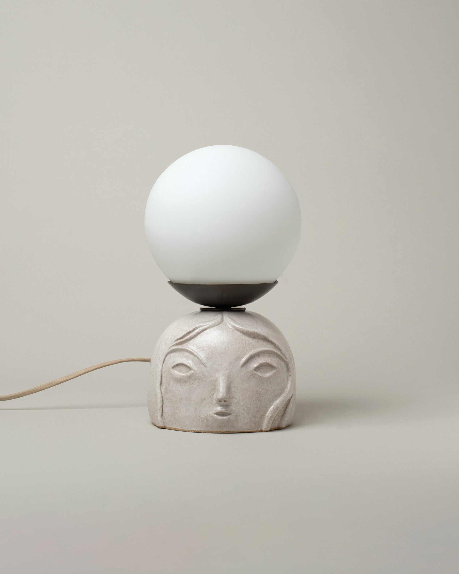 Rami Kim Small / White Floating Penelope Table Lamp on light color background.