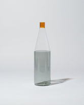 Ichendorf Milano Amber/Clear/Smoke Tequila Sunrise Bottle on light color background.