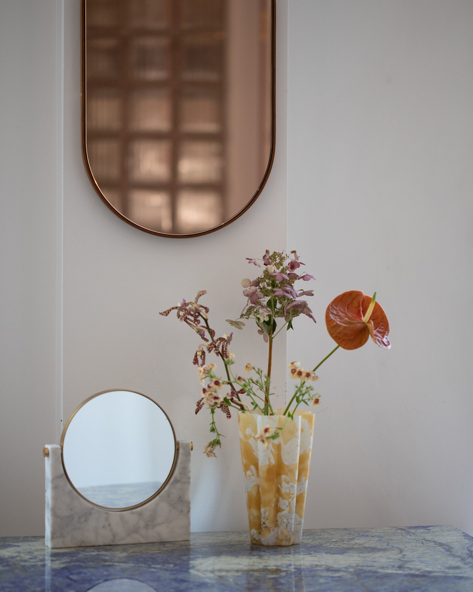 Styled image featuring Stories of Italy Medium Amber Nougat Bucket Vases.