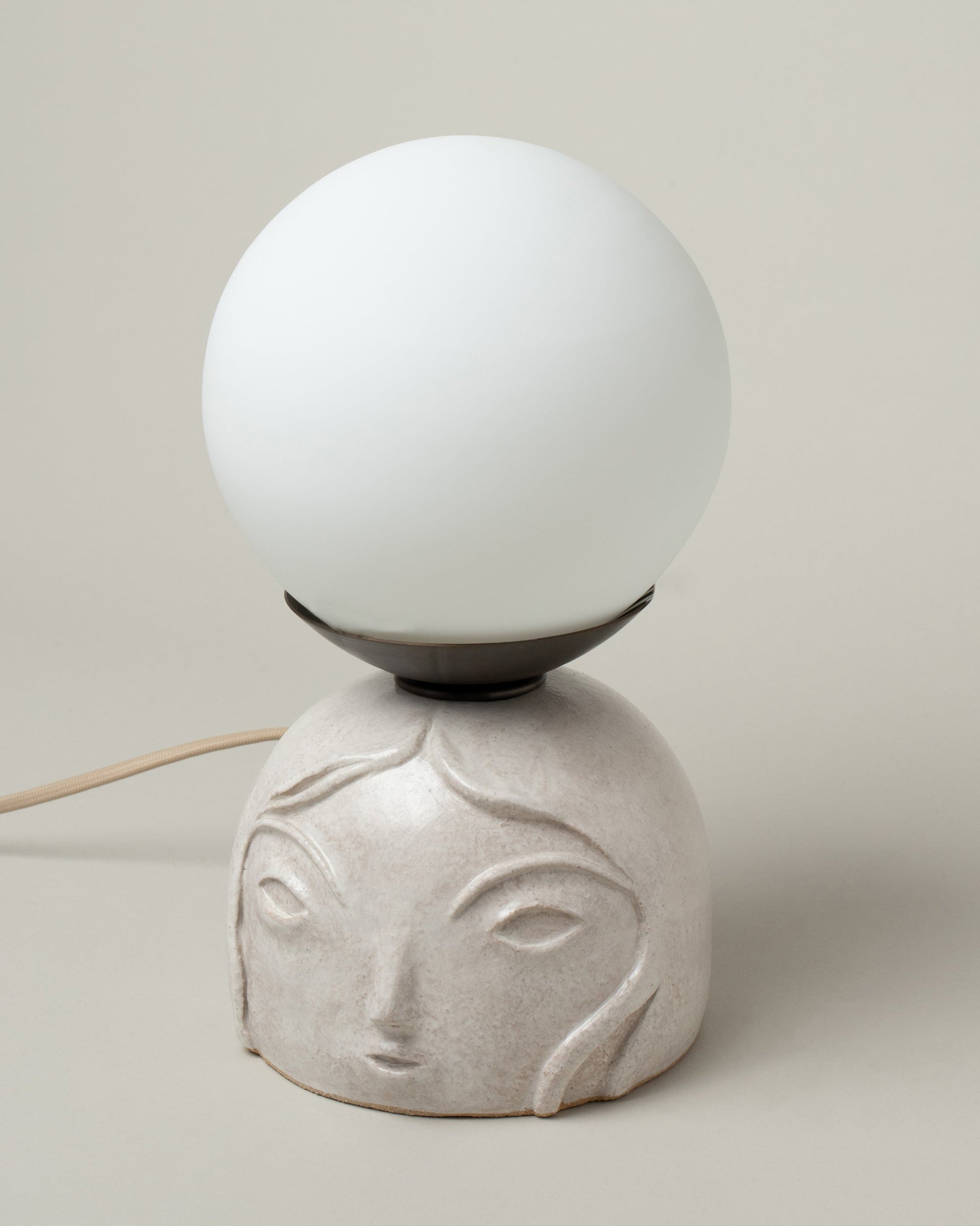 Rami Kim Small / White Floating Penelope Table Lamp on light color background.