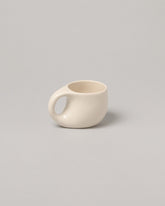 Dust and Form Small Cream Comfort Mug on light color background.