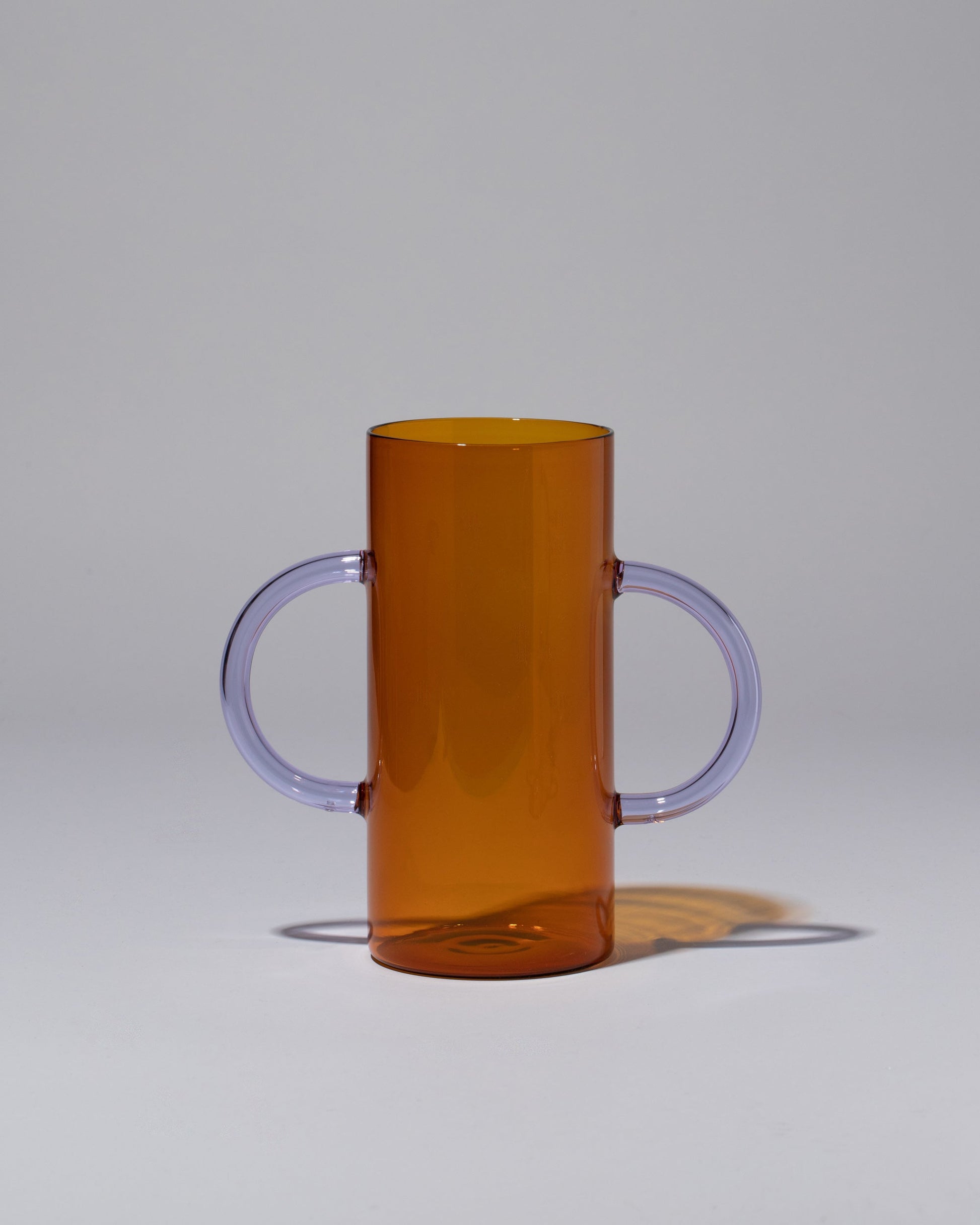 Sophie Lou Jacobsen Amber with Lilac Handles Handle Vase on light color background.