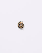 Spiral Earring Single Stud on light colored background.