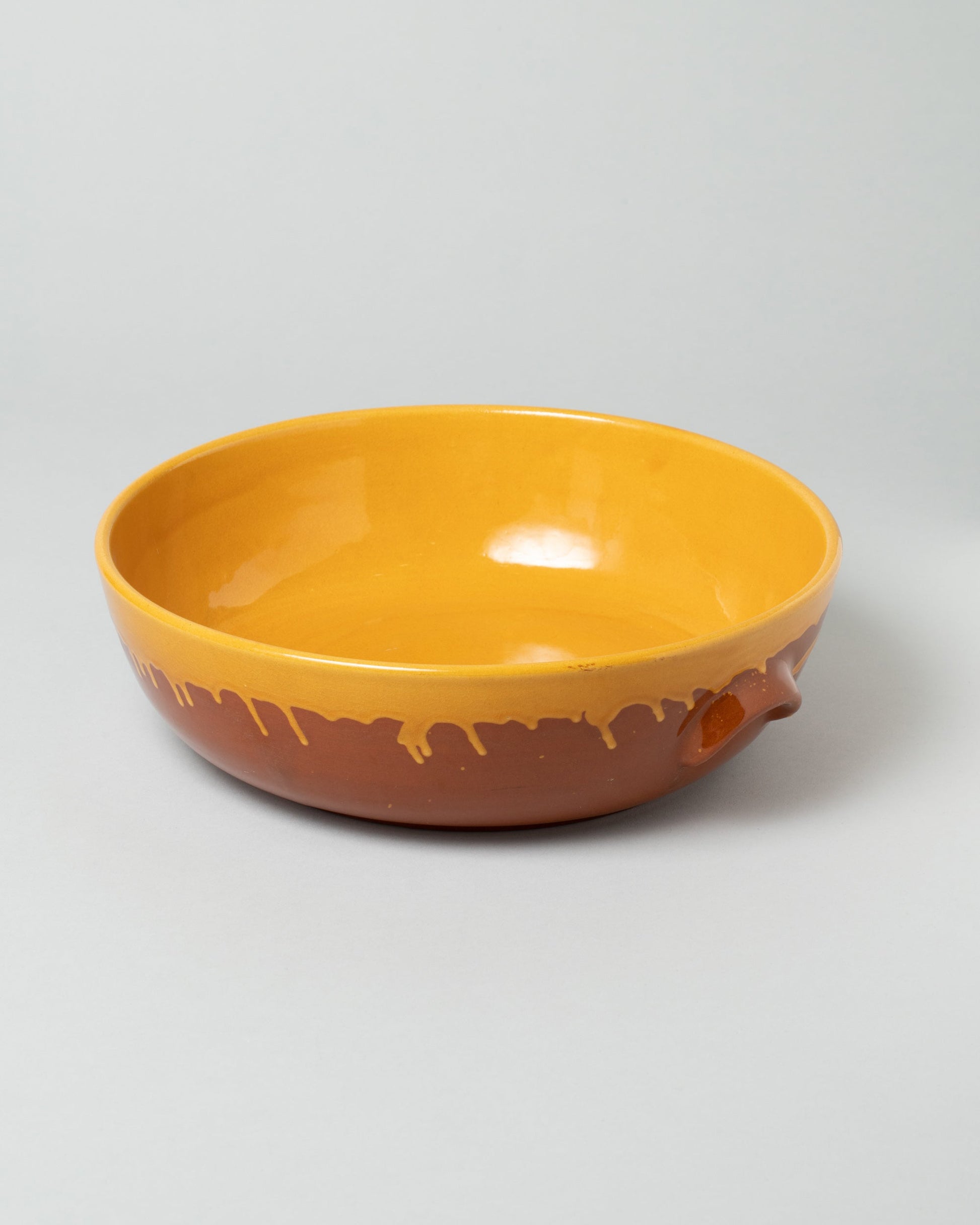 La Ceramica Vincenzo Del Monaco Caramel Yellow Large Salad Bowl on light color background.
