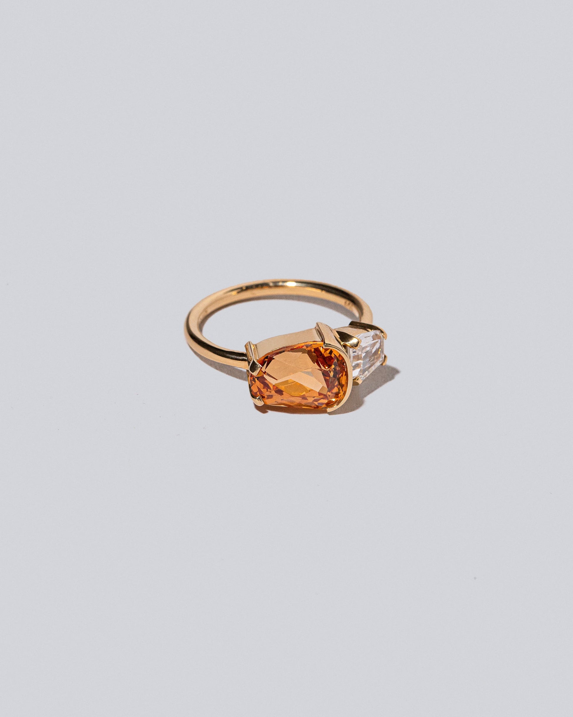 Product photo of Golden Poppy Ring on a light color background 