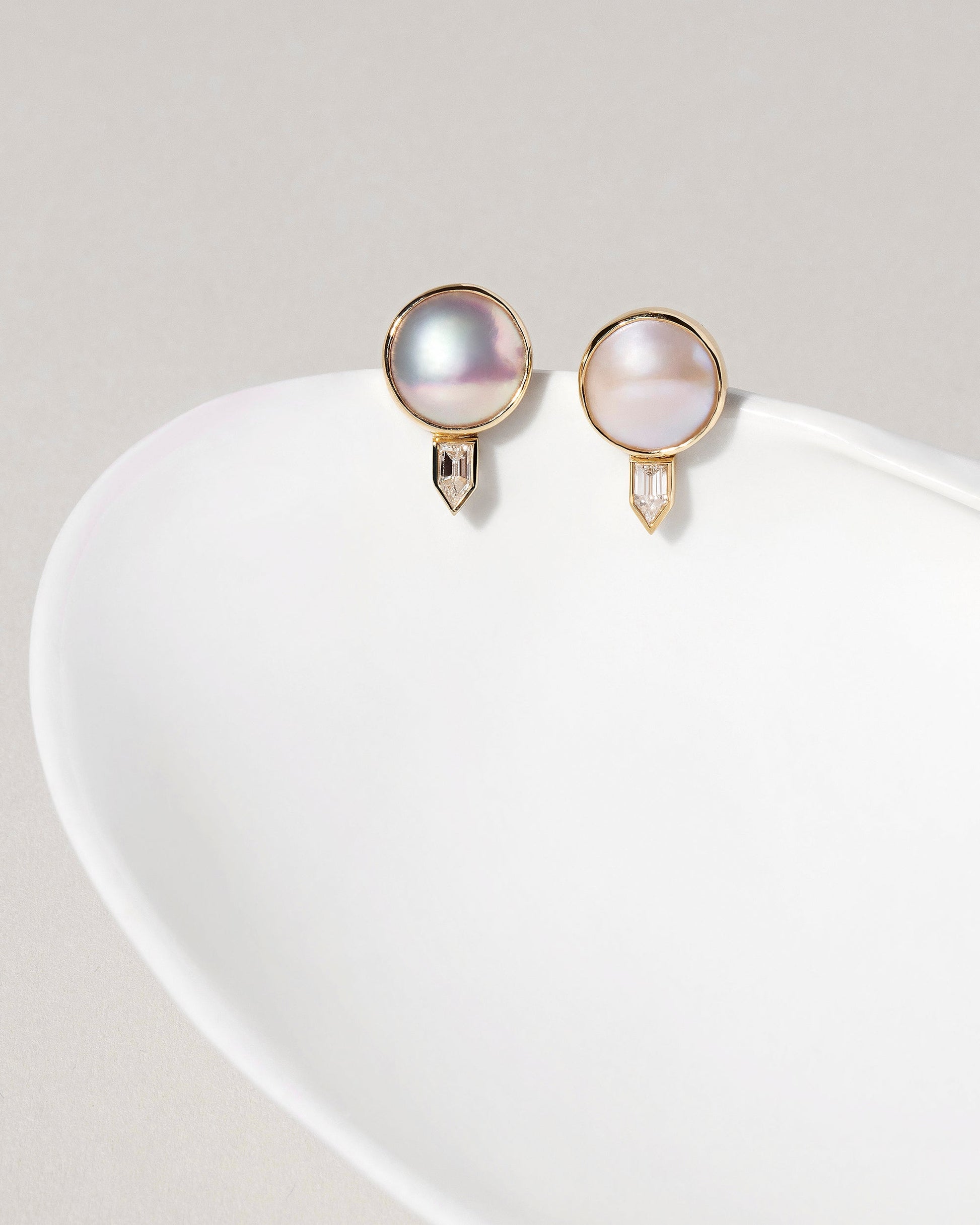  Mabe Pearl & Diamond Earrings on light color background.