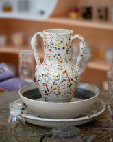 Styled image of the La Ceramica Vincenzo Del Monaco Small Colored Drops Ciarla Vase.