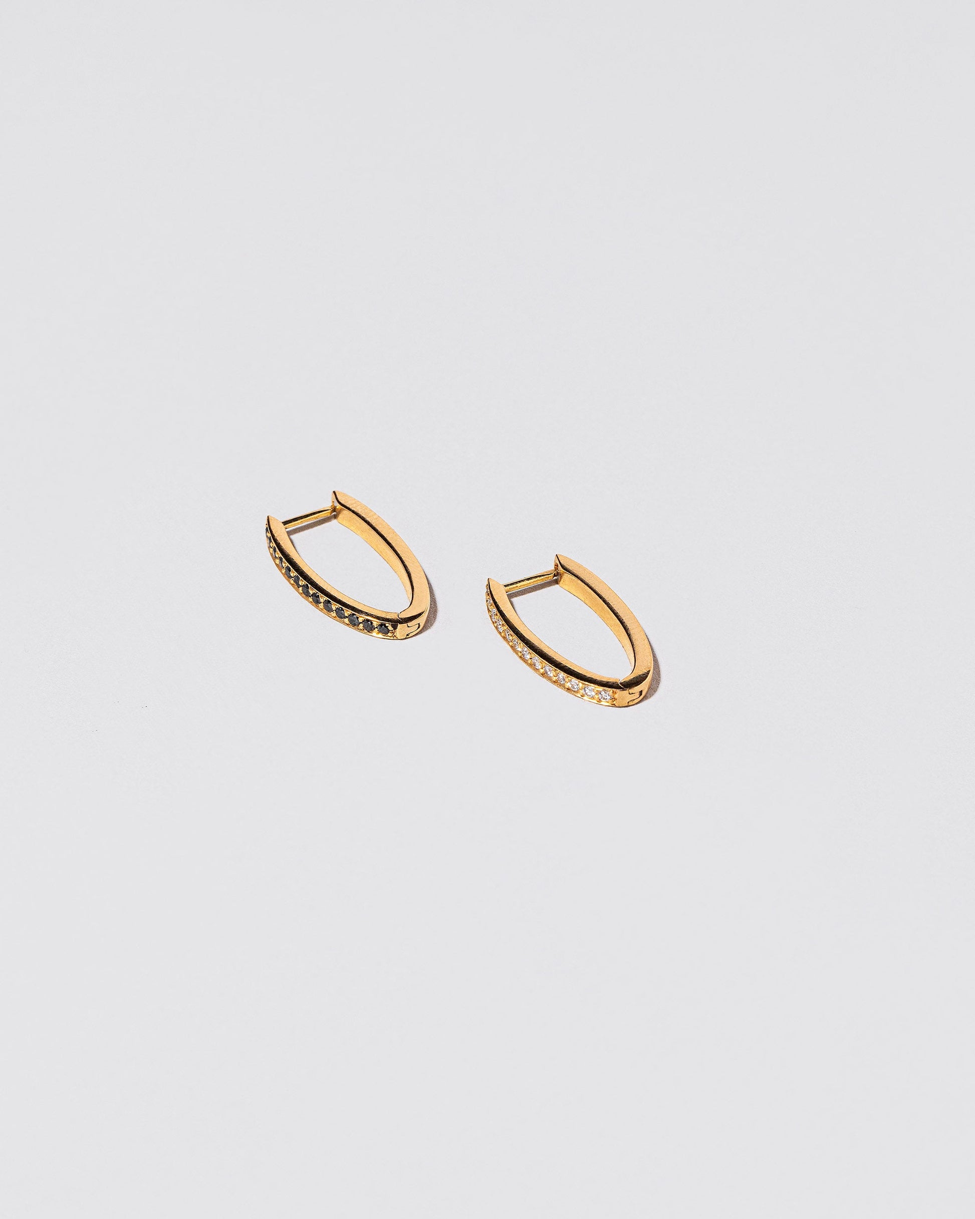 Tiny Loop Hoops on light colored background.
