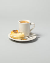 Spills Coffee & Bagel Breakfast on light color background.