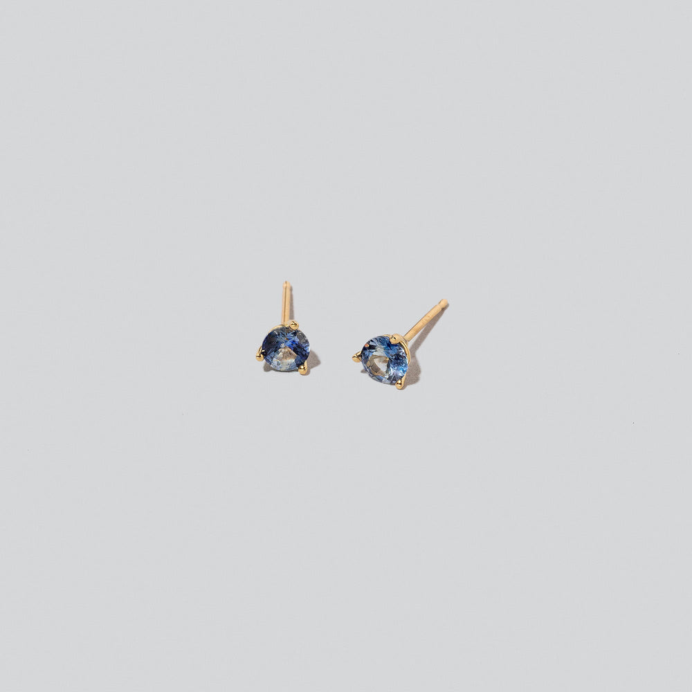 product_details::Martini Stud Earrings on light colored background.