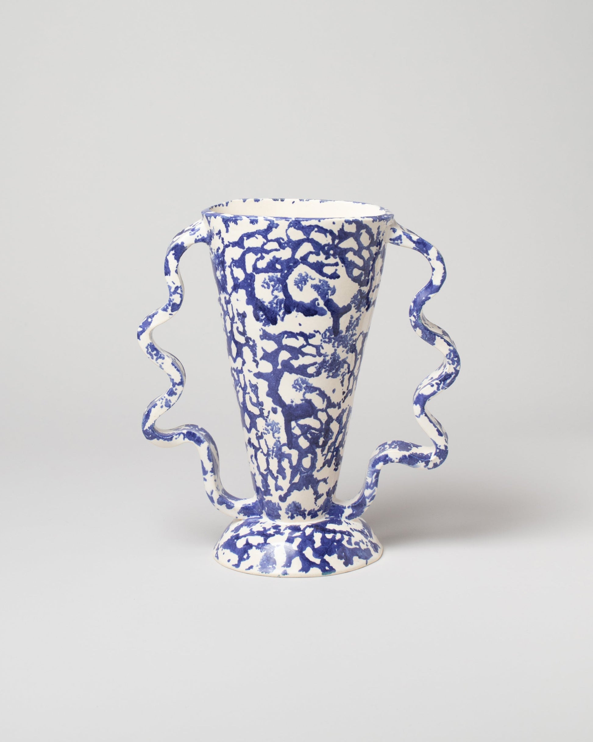 Morgan Peck Blue and White Stretch Vase on light color background.