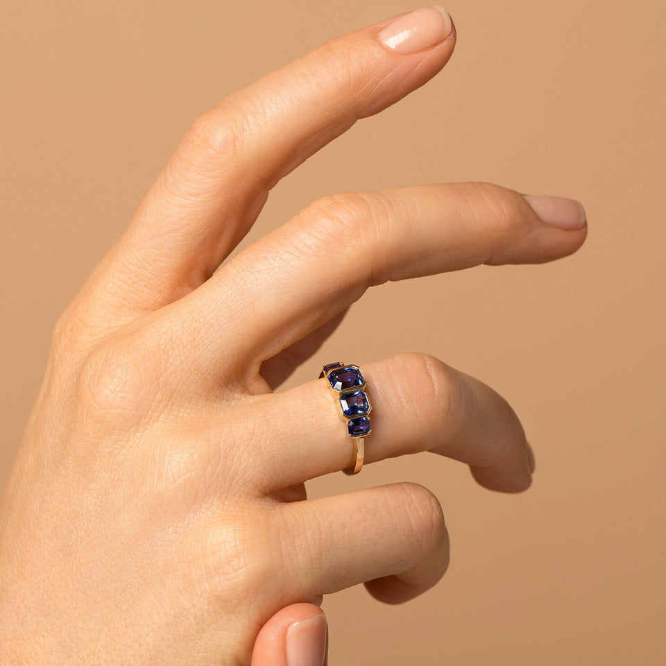 product_details::Geometric Sapphire Line Cluster Ring on model.