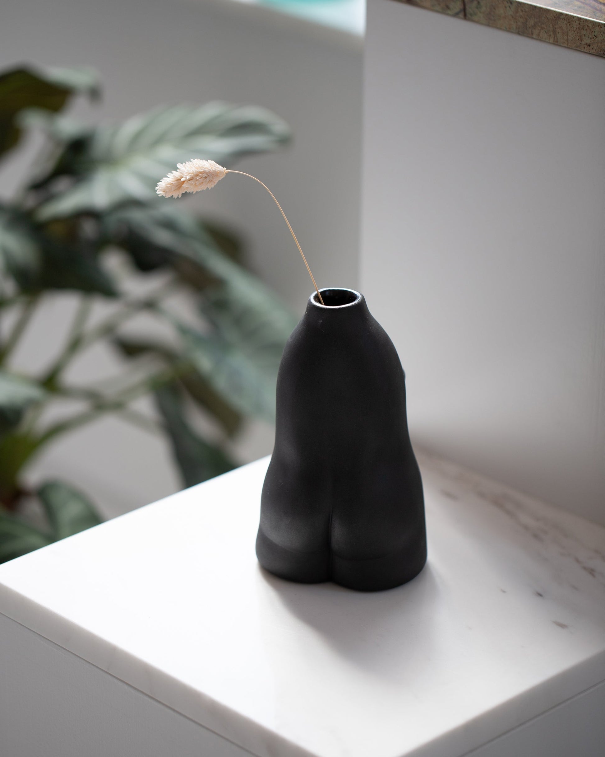 Styled image featuring the Rachel Saunders Black Woman Vase.