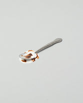  Spills Spoon on light color background.