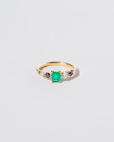  Seven Sisters Ring - Emerald on light color background.