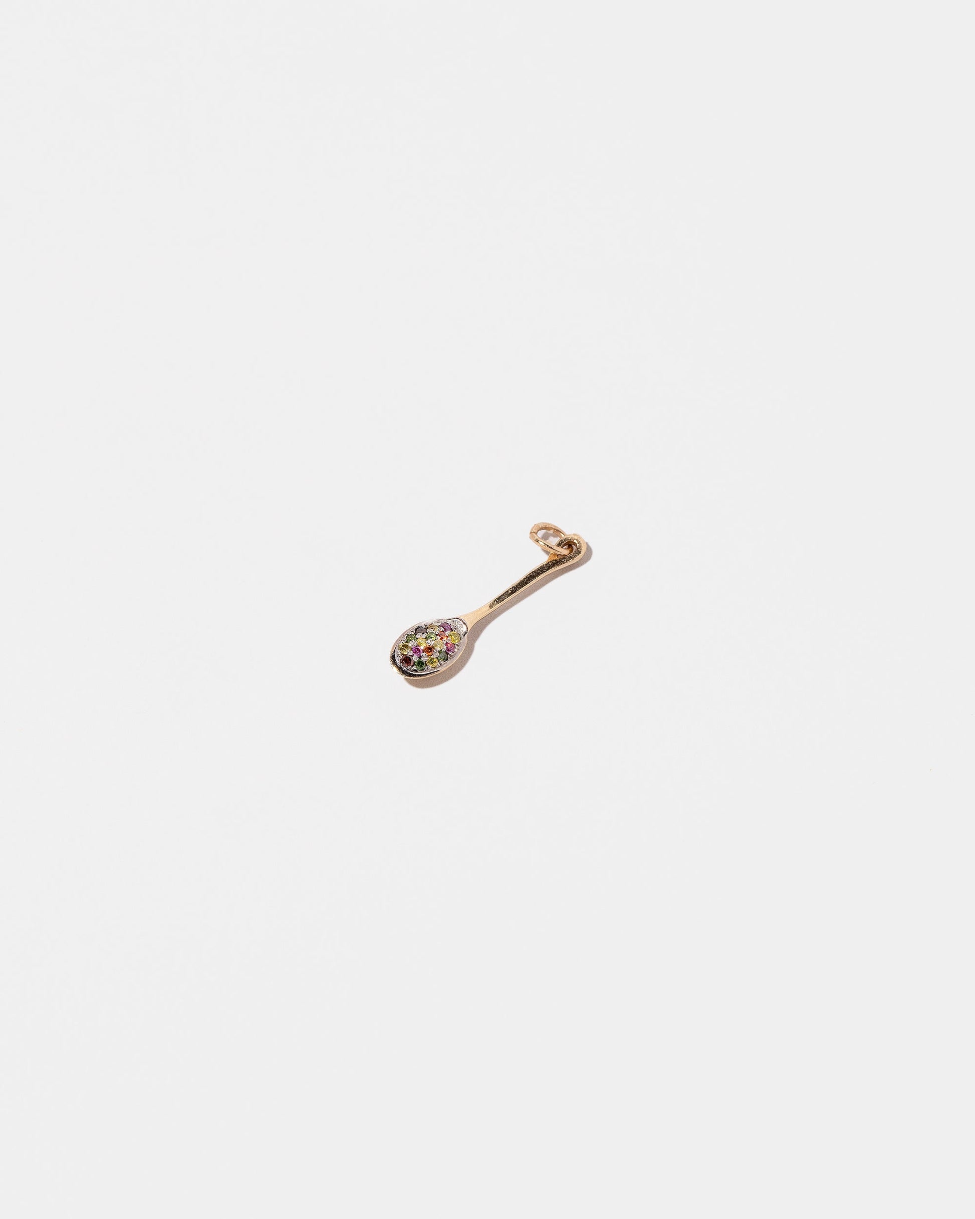  Cereal Spoon Charm on light color background.