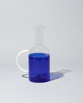 Ichendorf Milano Blue/Clear Tequila Sunrise Jug on light color background.