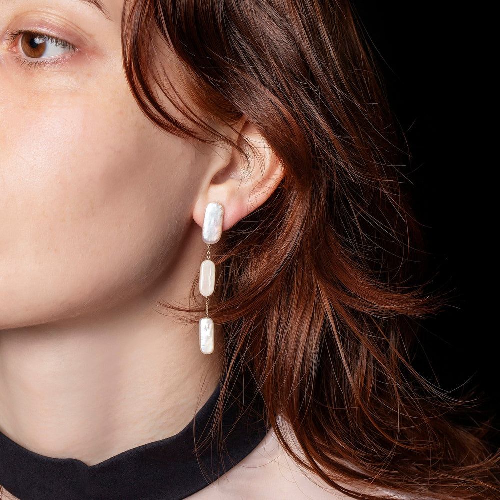 product_details::Pelias Earrings on model.