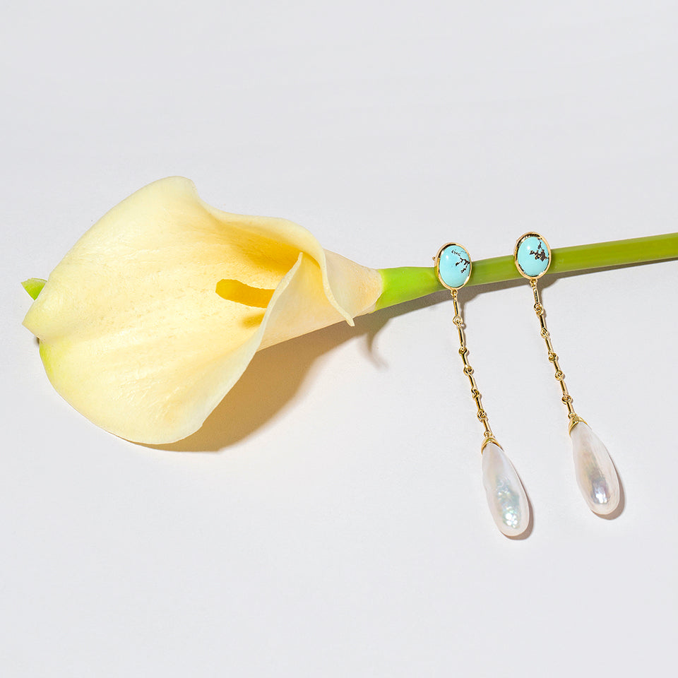 product_details:: Pearl & Turquoise Shoulder Dusters on light color background.