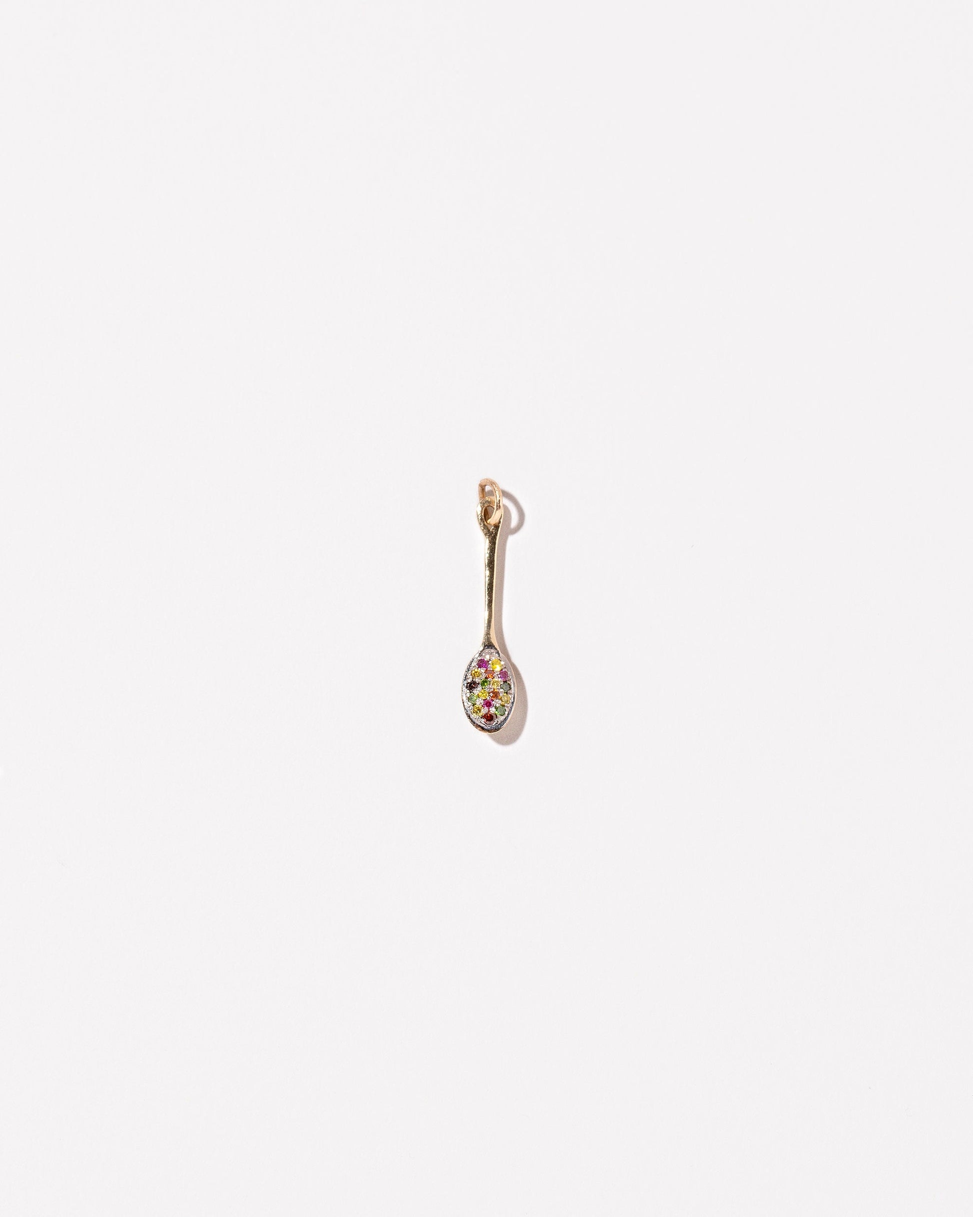  Cereal Spoon Charm on light color background.