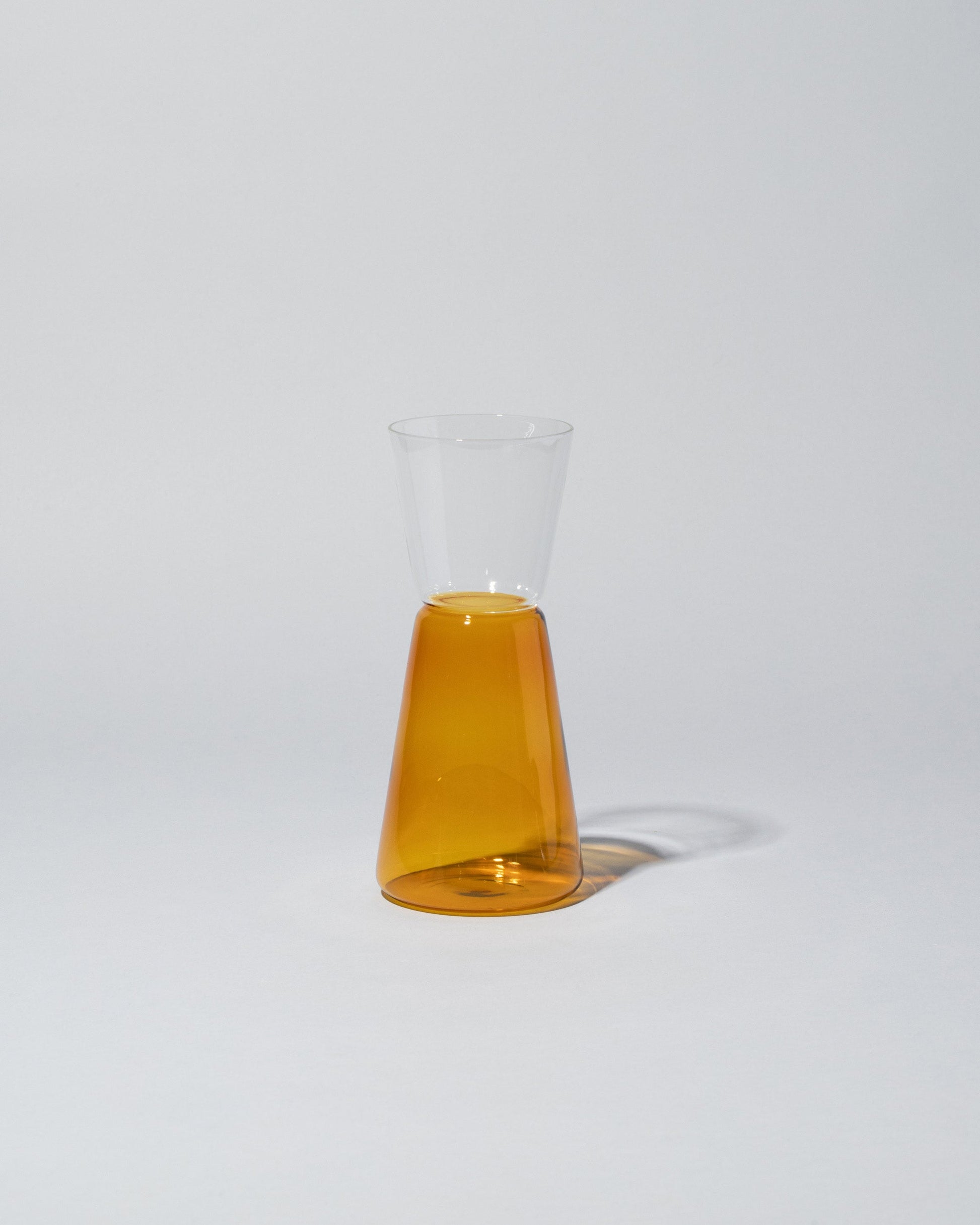 Ichendorf Milano Small Amber & Clear High Rise Pitcher on light color background.