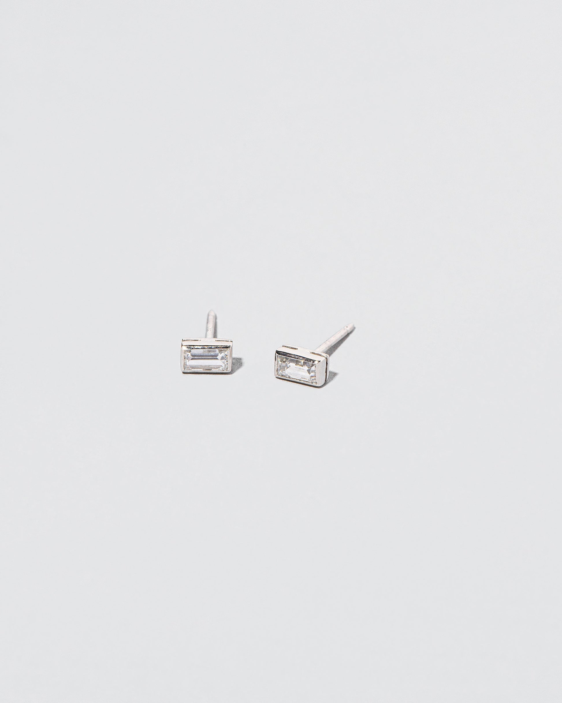  Baguette Studs in size small on light color background.