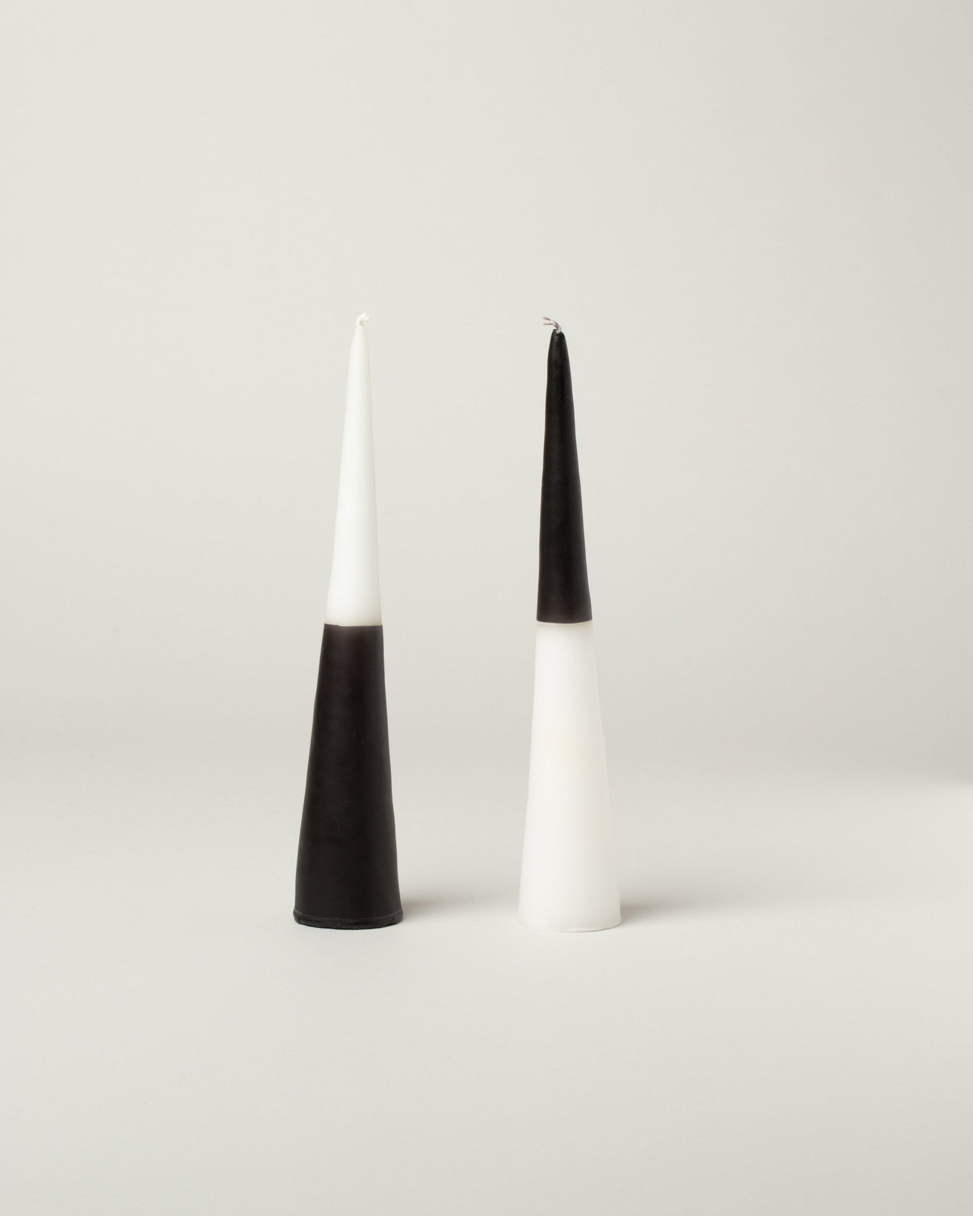 NíLE Yin Yang Cone Candles on light color background.