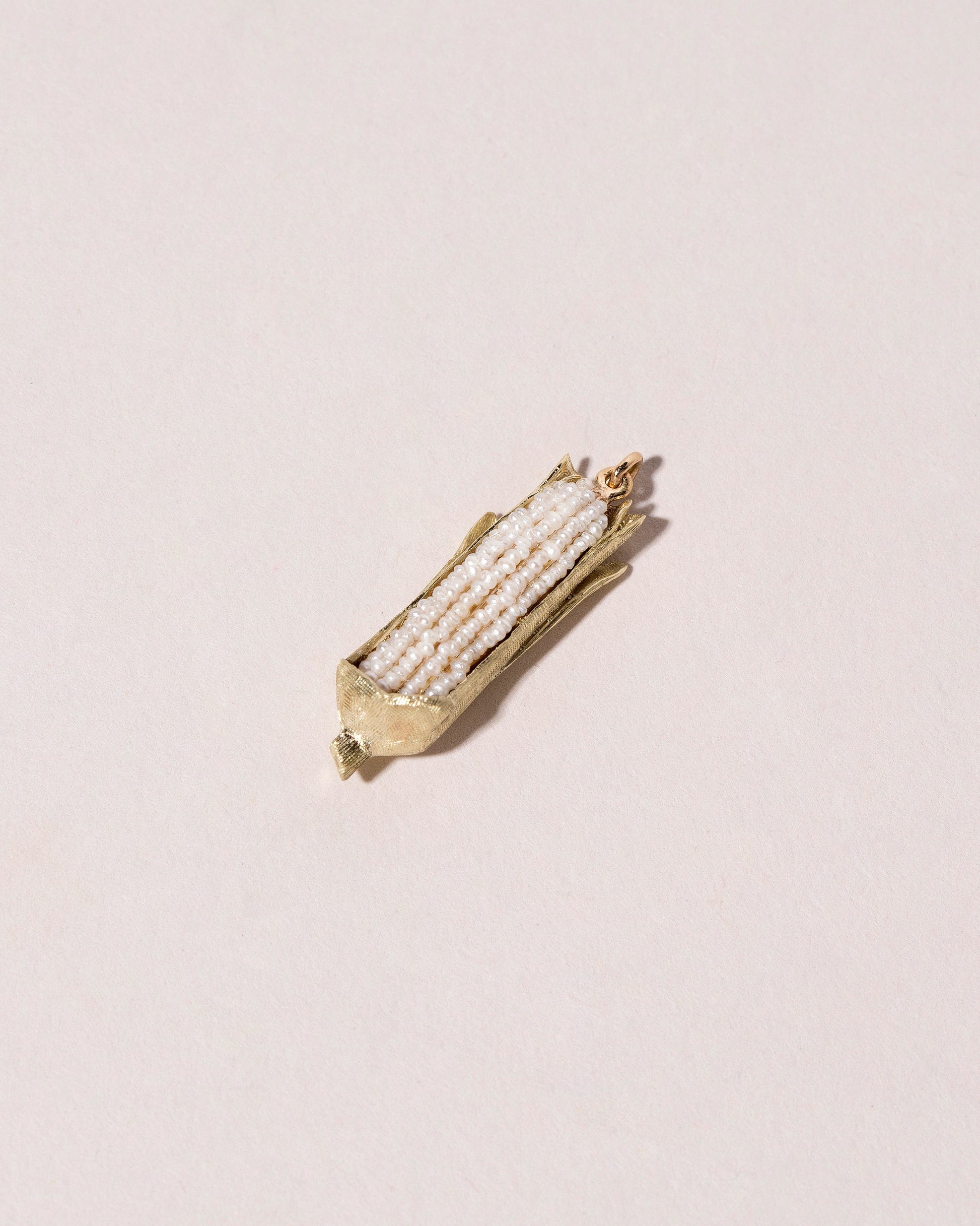 Corn on the Cob Charm on light color background.